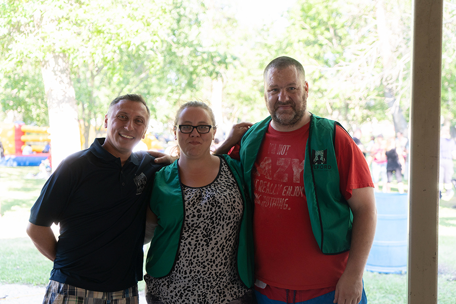 three people posing for a photo