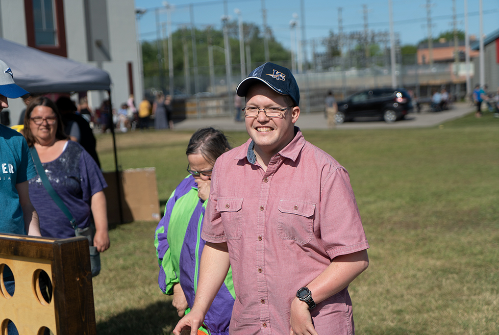 a smiling man playing a game